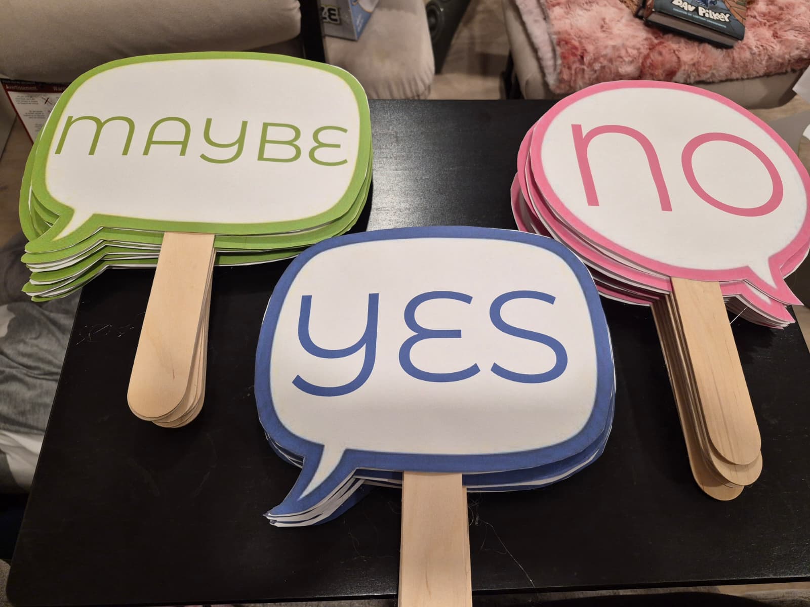Yes, no, and maybe answer paddles used for a club discussion activity